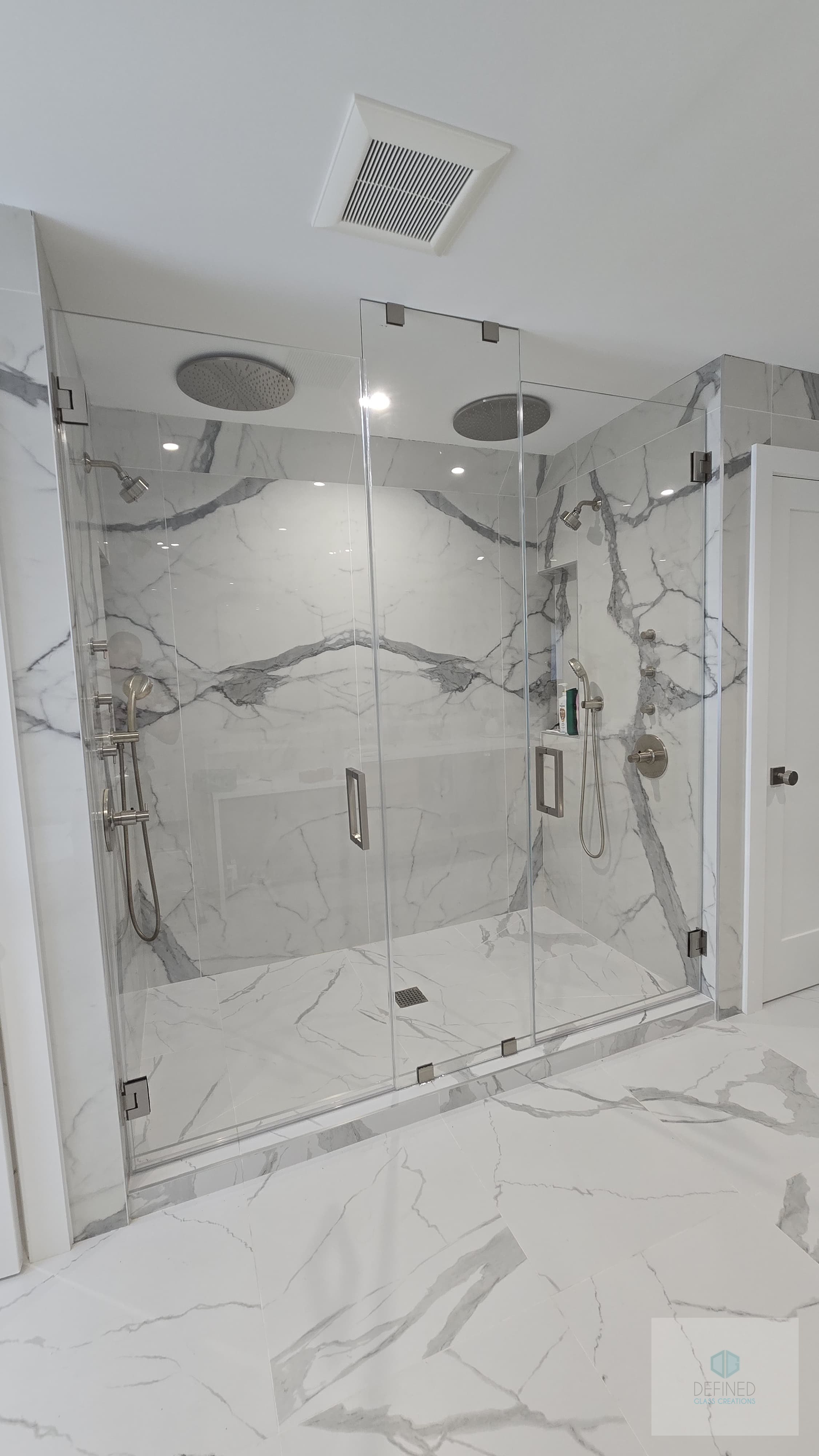 Glass shower enclosure